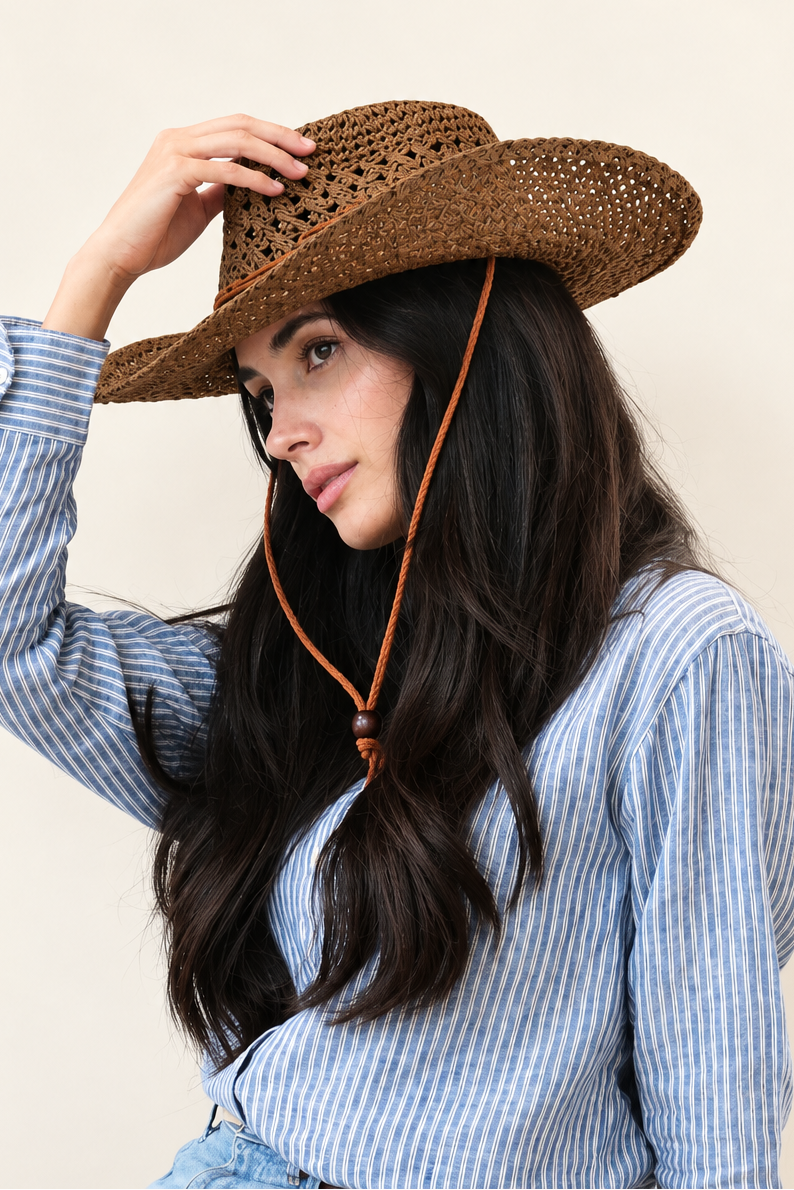 Side view of model adjusting Saddle Ridge Straw Cowboy Hat with casual blue denim outfit
