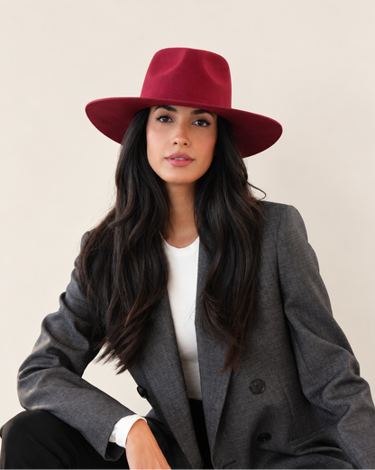 Model wearing Sable Wool Fedora Hat in Burgundy with charcoal blazer