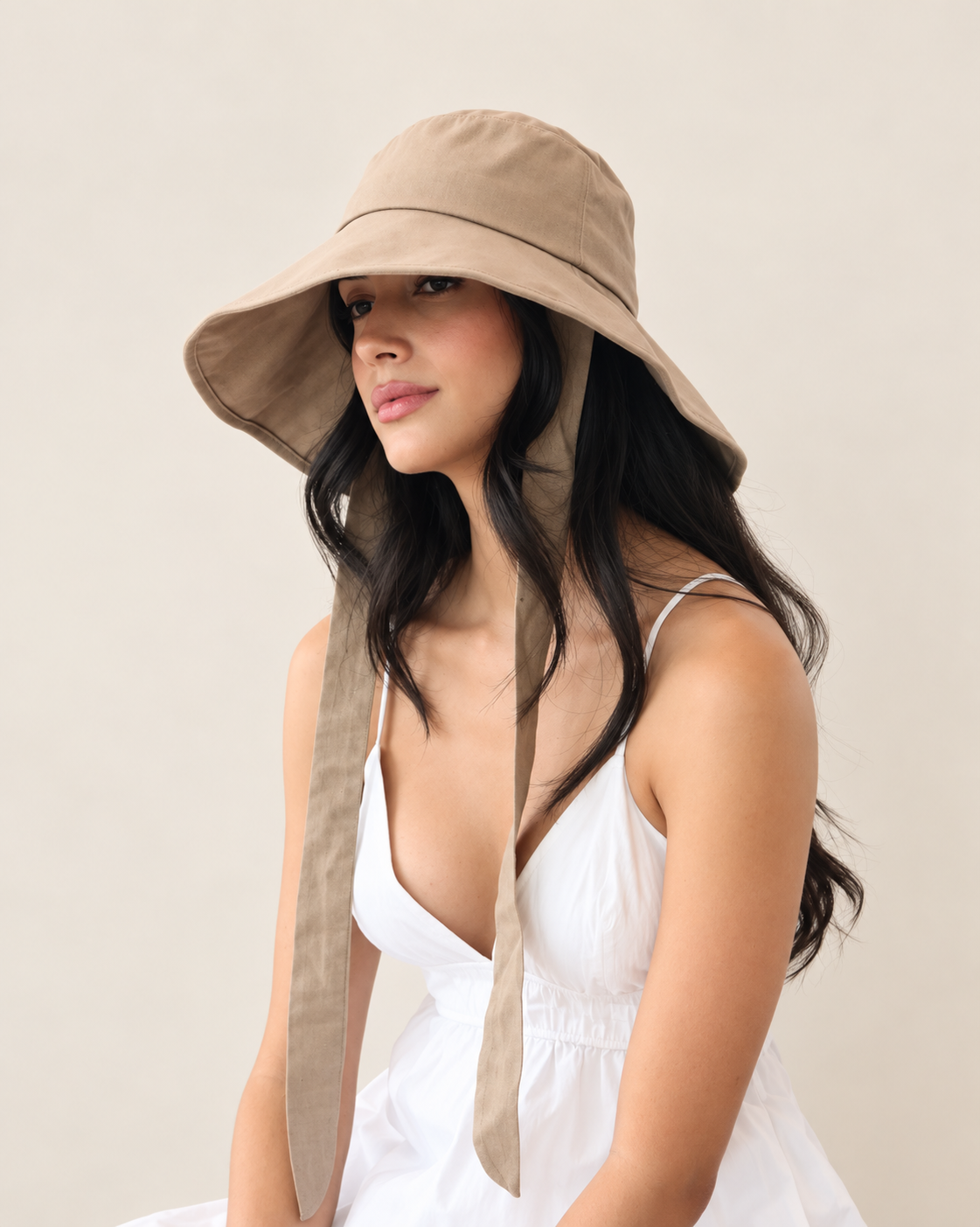 Side view of Coast Tan bucket hat with soft brim and fabric ties