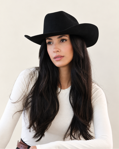 Model wearing Shadow black Clayton Wool Cowboy Hat with white long-sleeve top