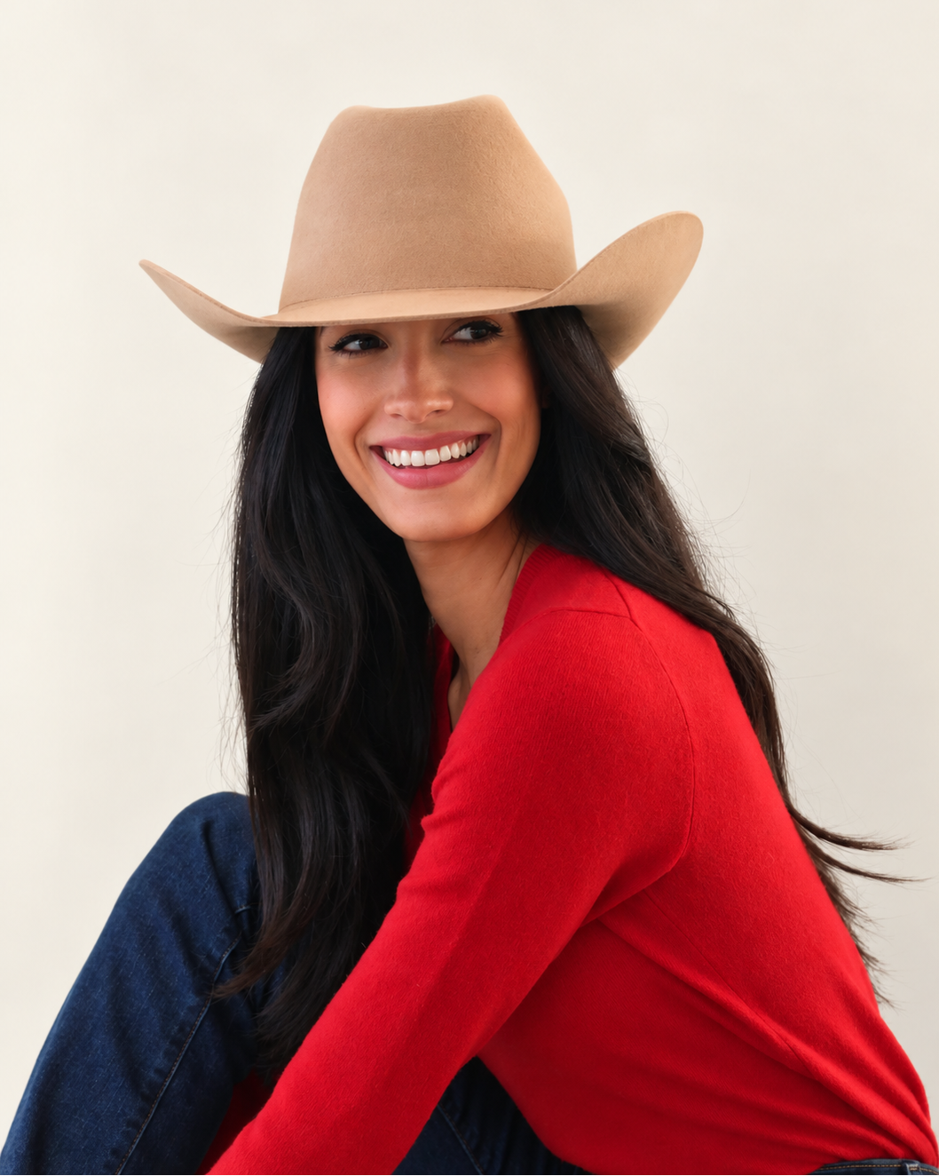 Model smiling in Chestnut Clayton Wool Cowboy Hat styled with red top