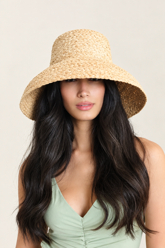 Model wearing Elia raffia bucket hat with mint green top