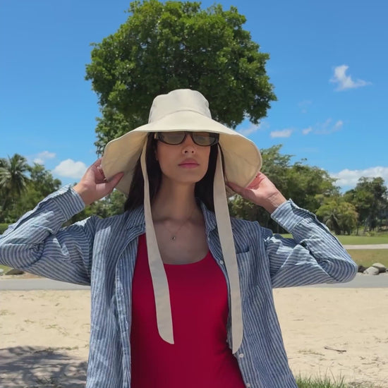 Coast Cream bucket hat styled outdoors with fabric ties